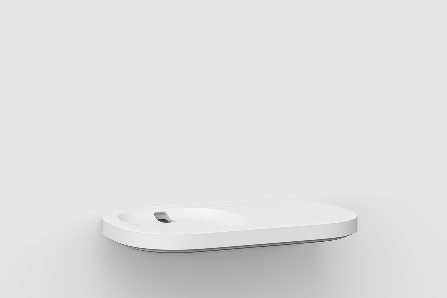 A white, rounded, wall-mounted shelf. It has a small depression in the center.