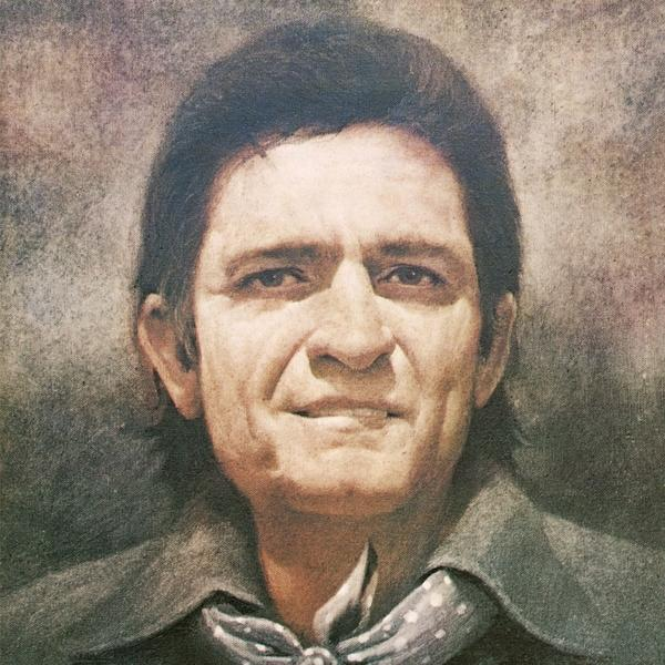 Portrait en gros plan de Johnny Cash, portant un manteau sombre, une écharpe à pois et une expression sévère.