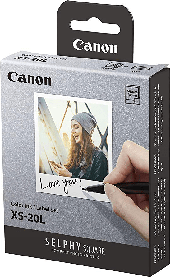 Une boîte de jeu d'encre et d'étiquettes Canon avec une femme écrivant sur une photo.