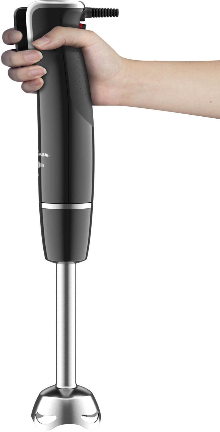 A hand holding a black and silver immersion blender.