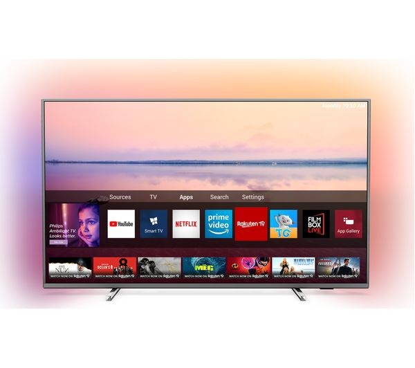 Un televisor de pantalla plana con una interfaz que muestra aplicaciones de transmisión. La pantalla muestra una escena de atardecer.