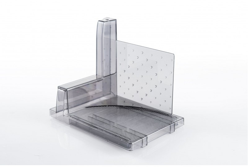 A transparent food slicer with many parallel blades and a cutting guide.
