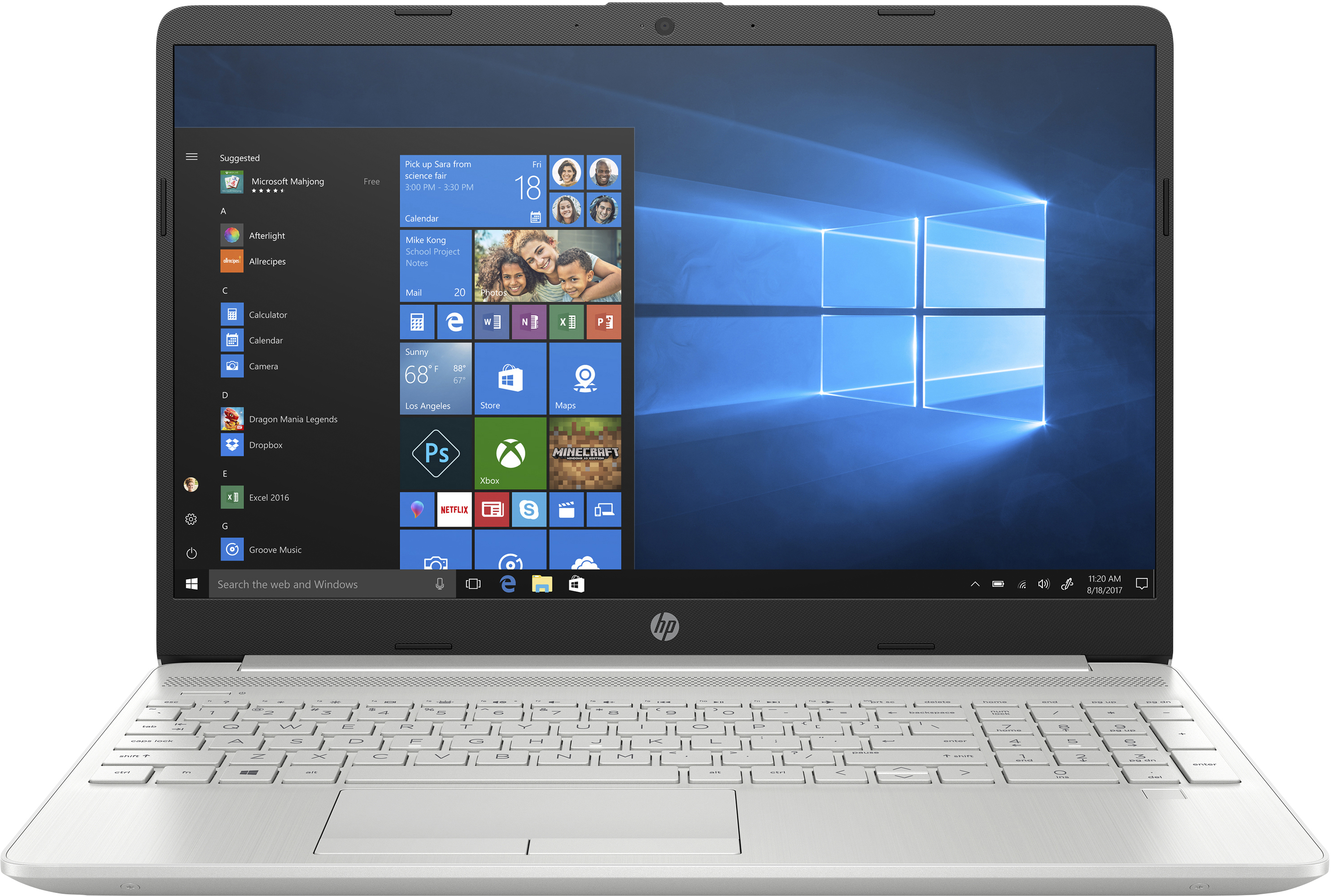 Ein silberner HP-Laptop mit offenem Startmenü auf dem blauen Windows 10-Bildschirm.