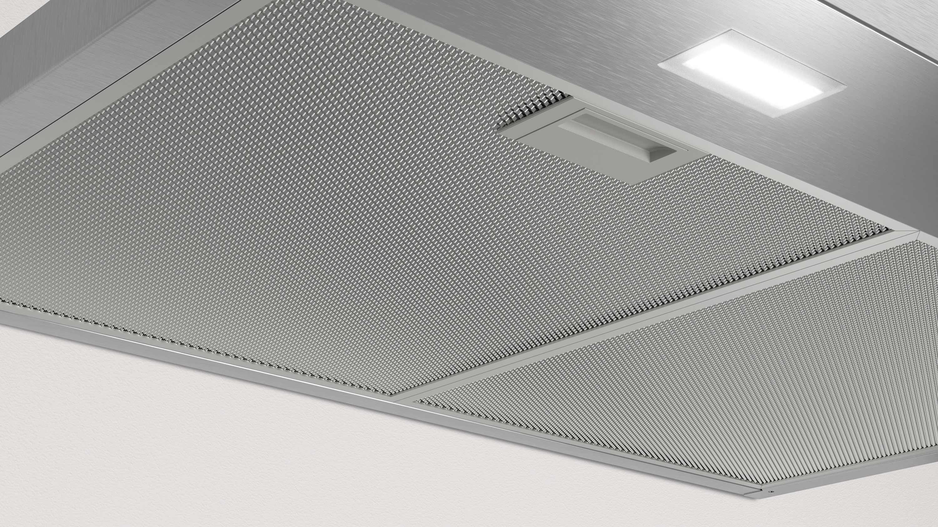 Un primer plano de un filtro de metal con una luz.