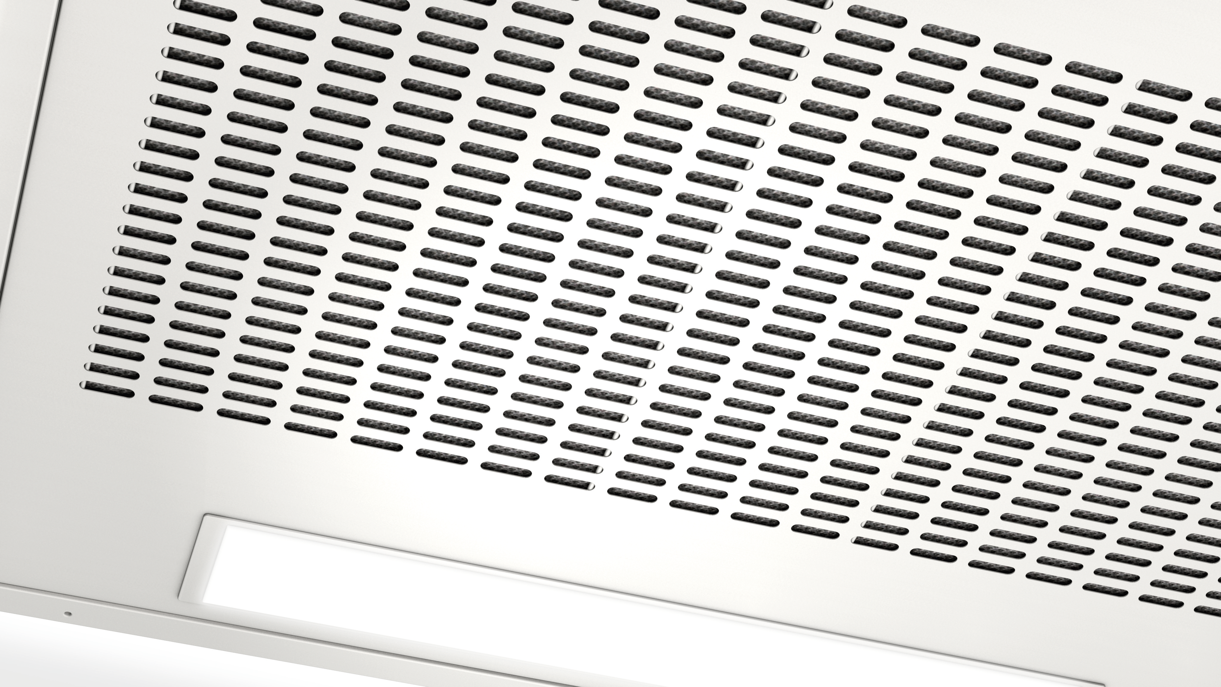 White, rectangular range hood vent with small holes and a light.