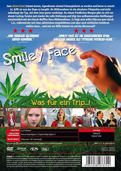 DVD-Hülle. Eine Frau berührt ein Smiley-Gesicht auf gelbem Hintergrund.