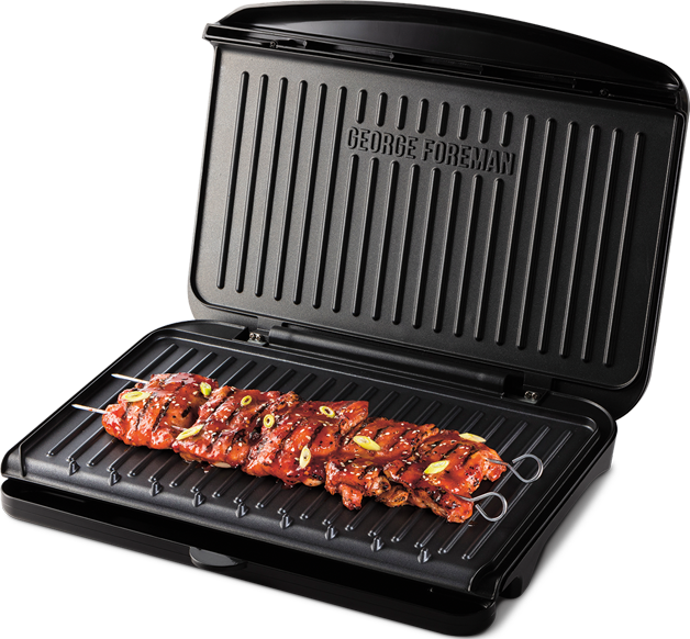 George Foreman grill sült hússal. Fekete grill grillnyomokkal. Húsválogatások.