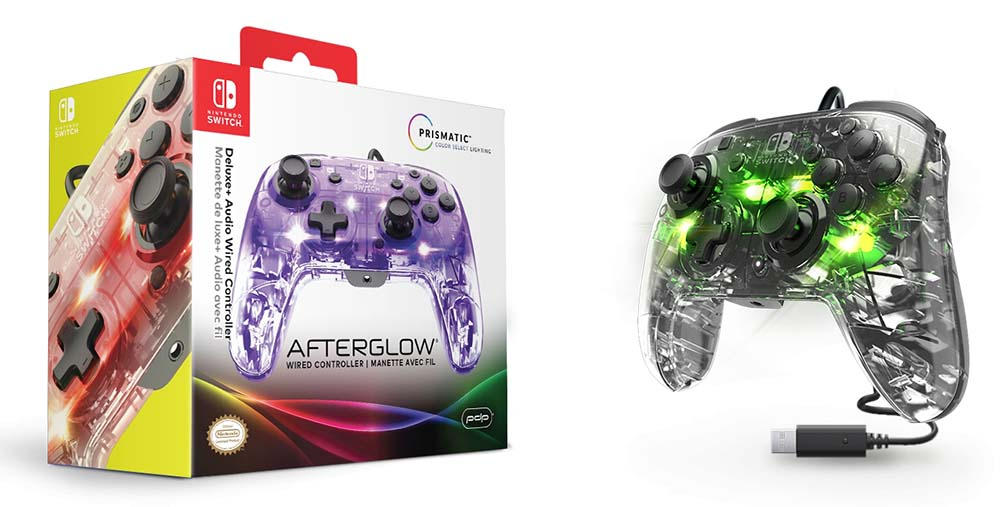 Gaming controller with box. Clear controller with purple lights, black buttons. USB cable.
