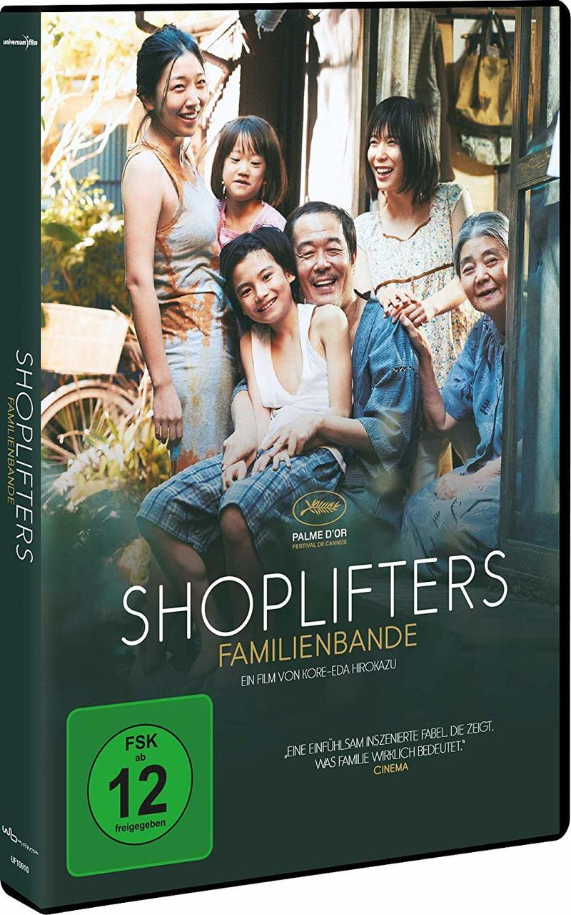 DVD-Hülle, Familienporträt. Sechs Personen posieren im Freien. Der Text lautet "Shoplifters".
