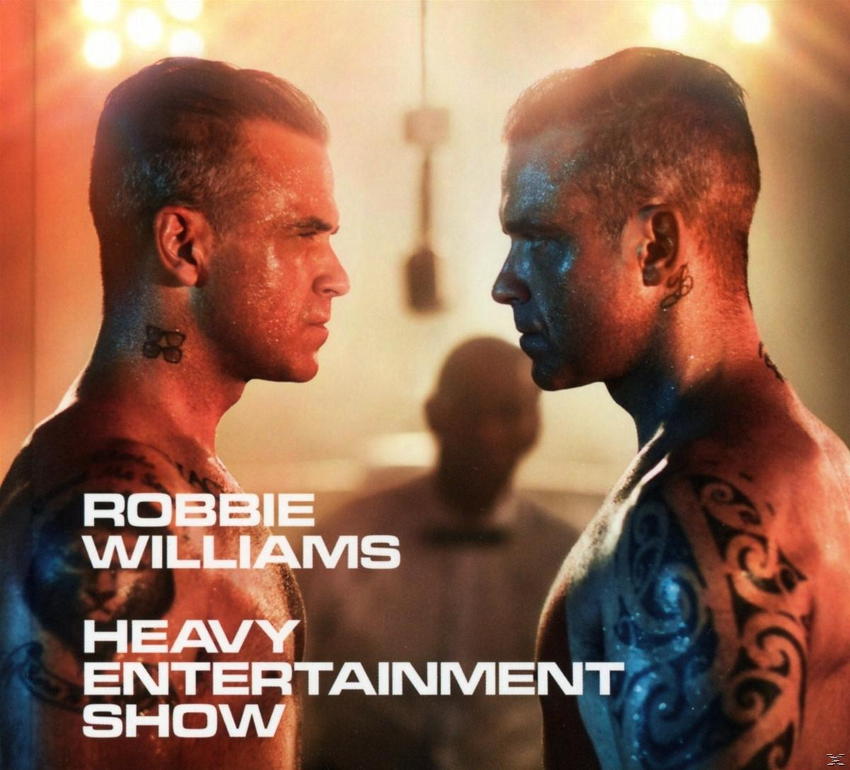 Két férfi bokszállásban egymással szemben; a szöveg 'Robbie Williams Heavy Entertainment Show'.