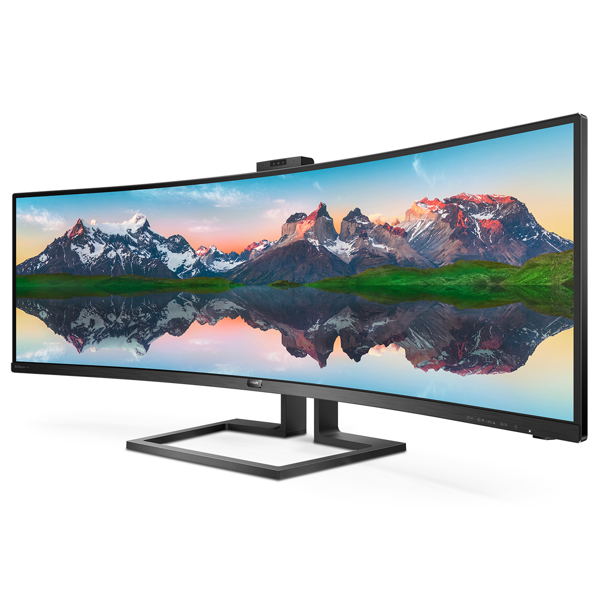 Un ampio monitor Philips curvo mostra un pittoresco paesaggio montano con riflesso.