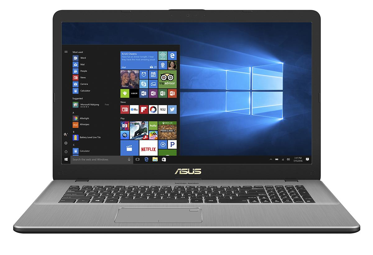 Ein offener ASUS Laptop zeigt den Windows 10 Startbildschirm und die Taskleiste.