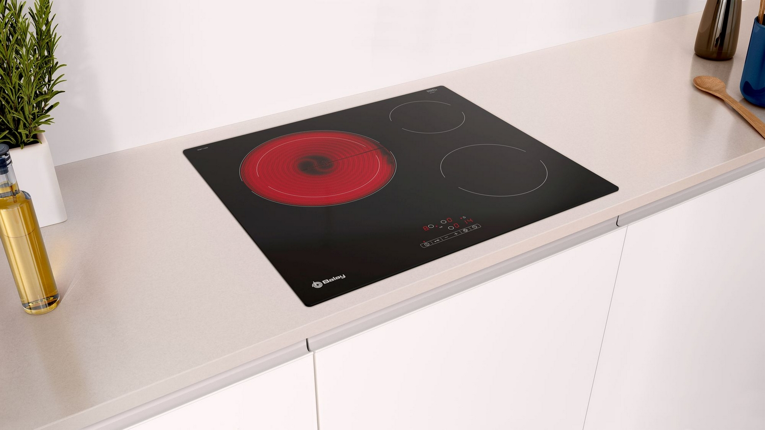 Placa de inducción negra con tres quemadores, algunos rojos, en encimera blanca.