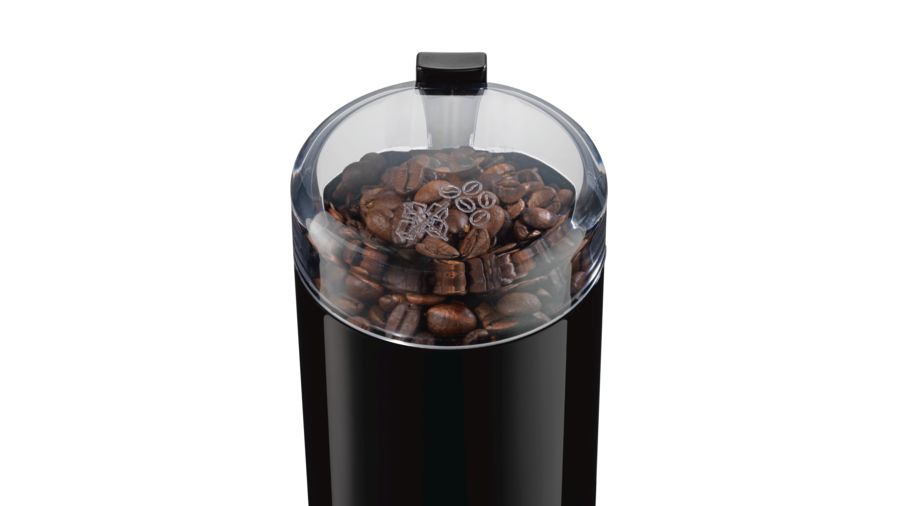 Un molinillo de café negro y transparente con granos de café dentro.