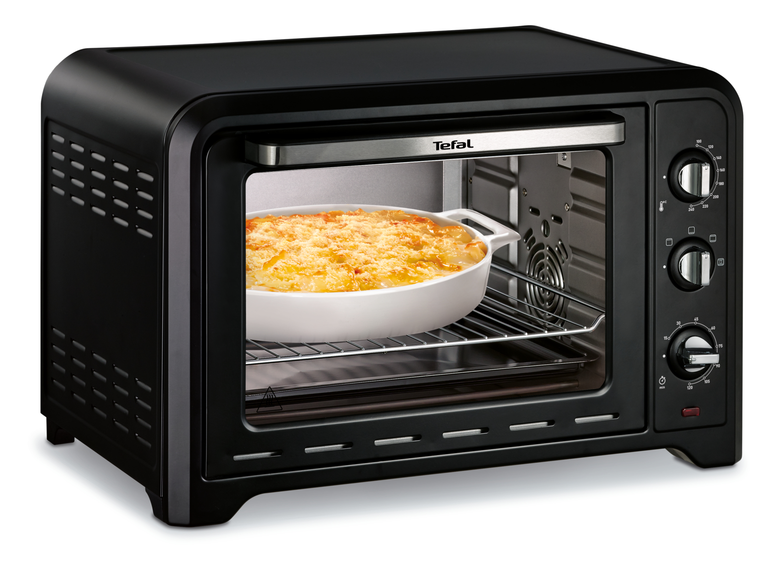 Een zwarte Tefal-oven wordt getoond met een gerecht erin. De oven staat op een wit oppervlak.