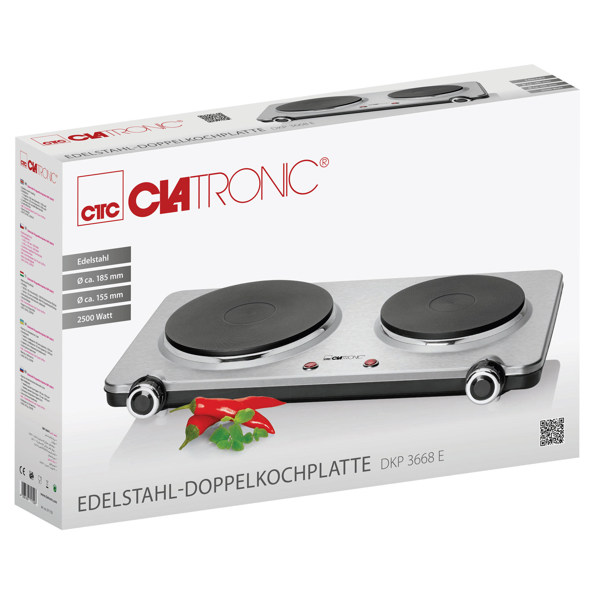 Doppelte elektrische Kochplatte in einer Box. Box hat Produktname und Clatronic Logo. Rote Chilis davor.