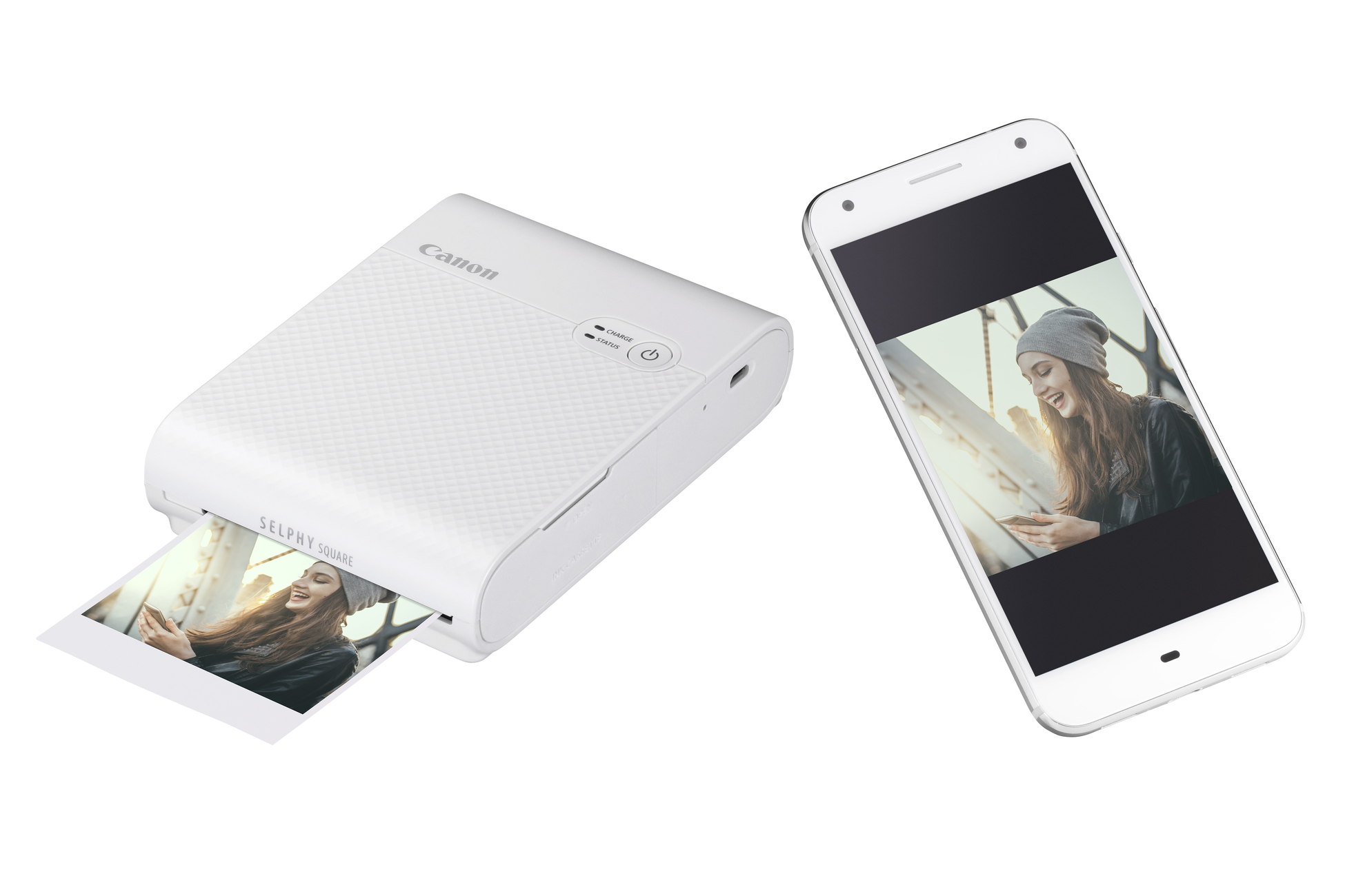 Canon Selphy Square printer and a phone displaying a picture of a person. White background.