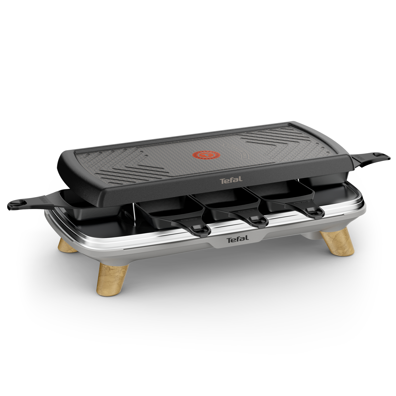 A black and silver raclette grill on a white surface.