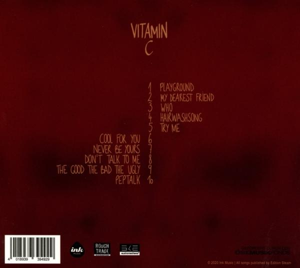 Vitamin C Album-Rückseite mit Titelliste auf dunkelrotem Hintergrund, weißer Text.