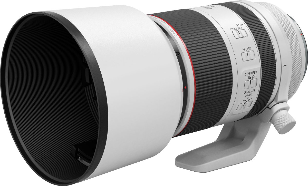 Un téléobjectif Canon blanc et noir avec des touches de rouge et un pare-soleil.