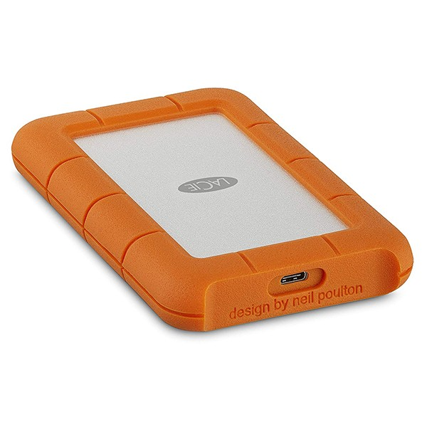 Disco duro externo naranja y resistente con superficie superior blanca, mostrando la marca 'LACIE'.