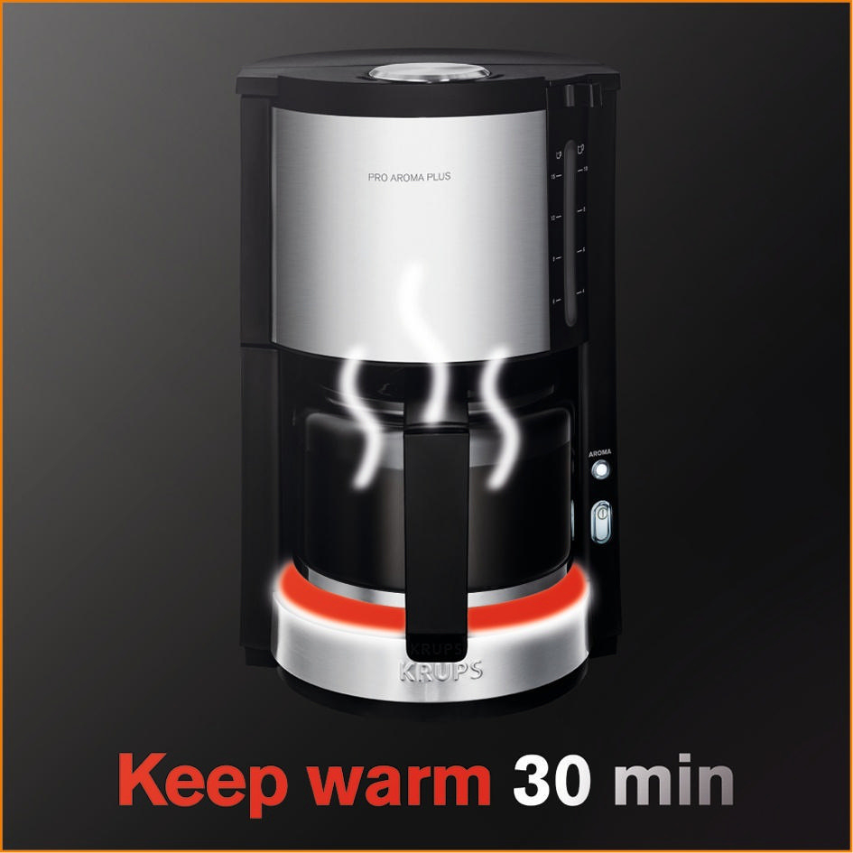 Schwarze und silberne Krups-Kaffeemaschine, Dampf steigt auf, mit Text "Keep warm 30 min".