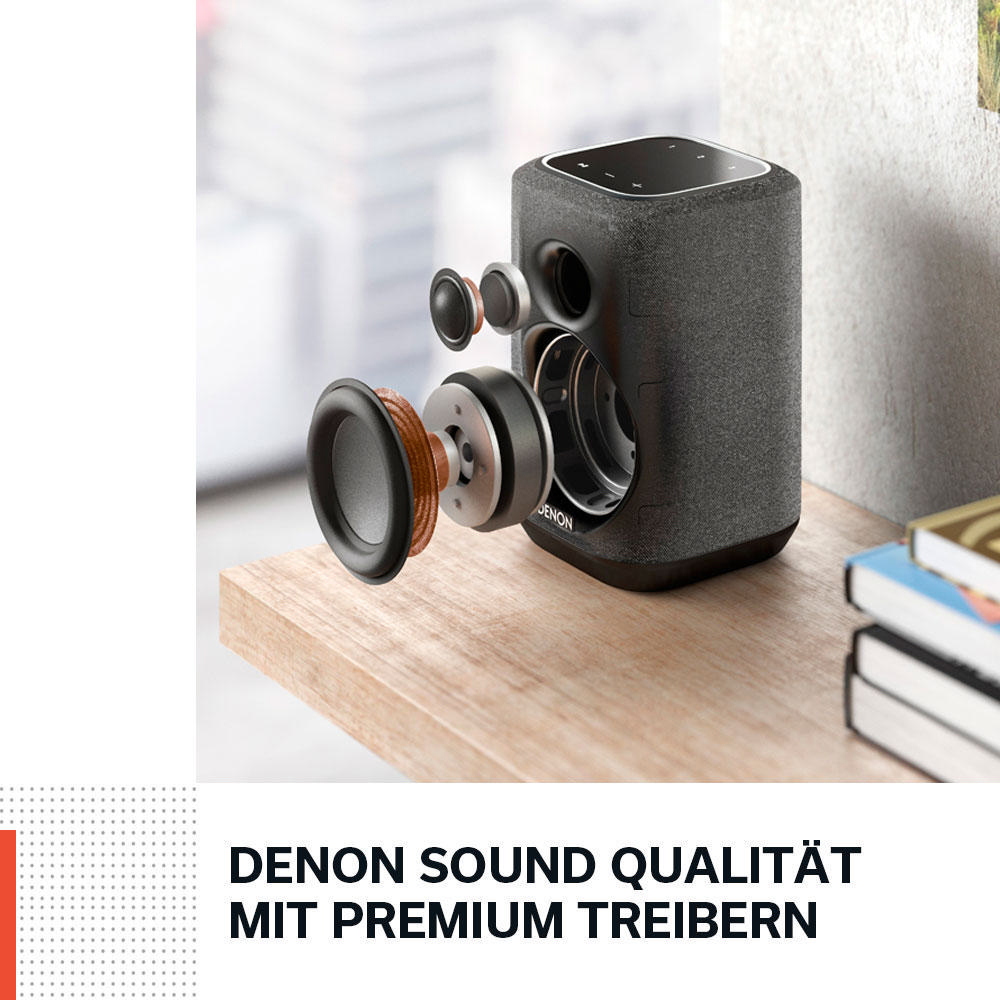 Eine Explosionsansicht eines schwarzen Lautsprechers. Komponenten werden angezeigt, und der Text lautet 'Denon Sound Qualität'.