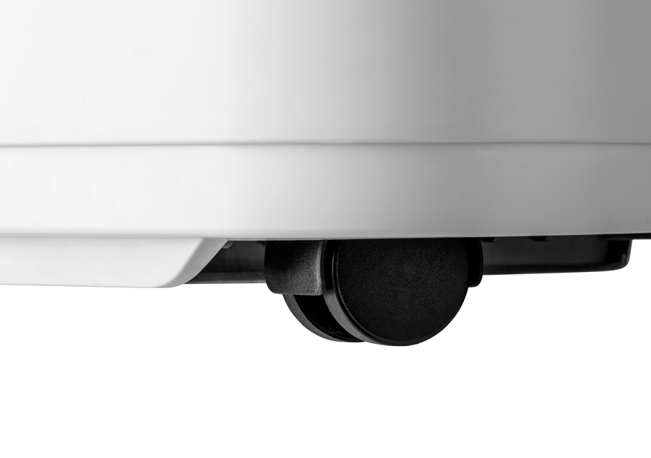 Zwart wiel op een wit oppervlak. Het is een klein wiel, waarschijnlijk onderdeel van een groter apparaat.