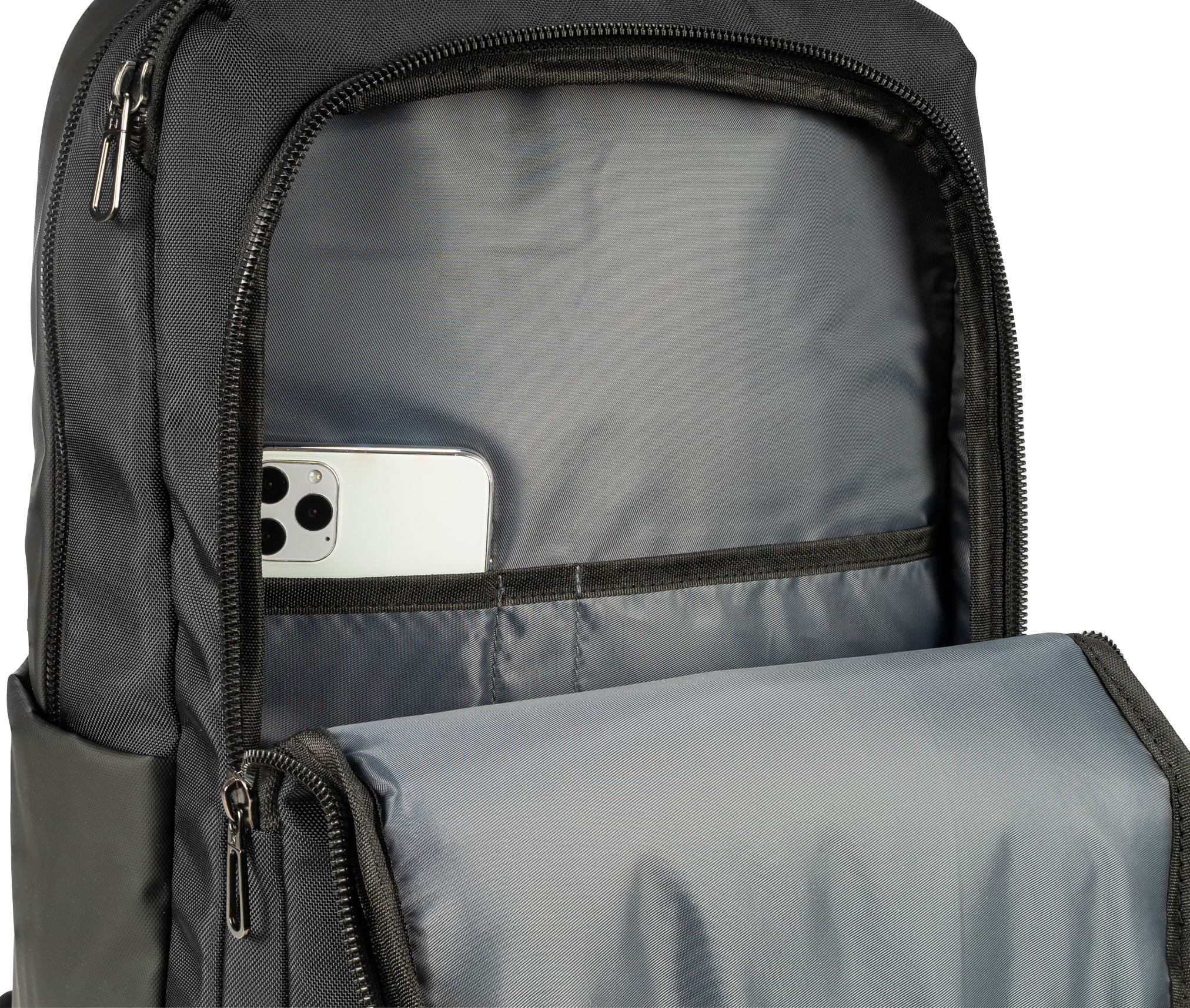 Téléphone blanc dans une poche de sac à dos noir, ouvert.