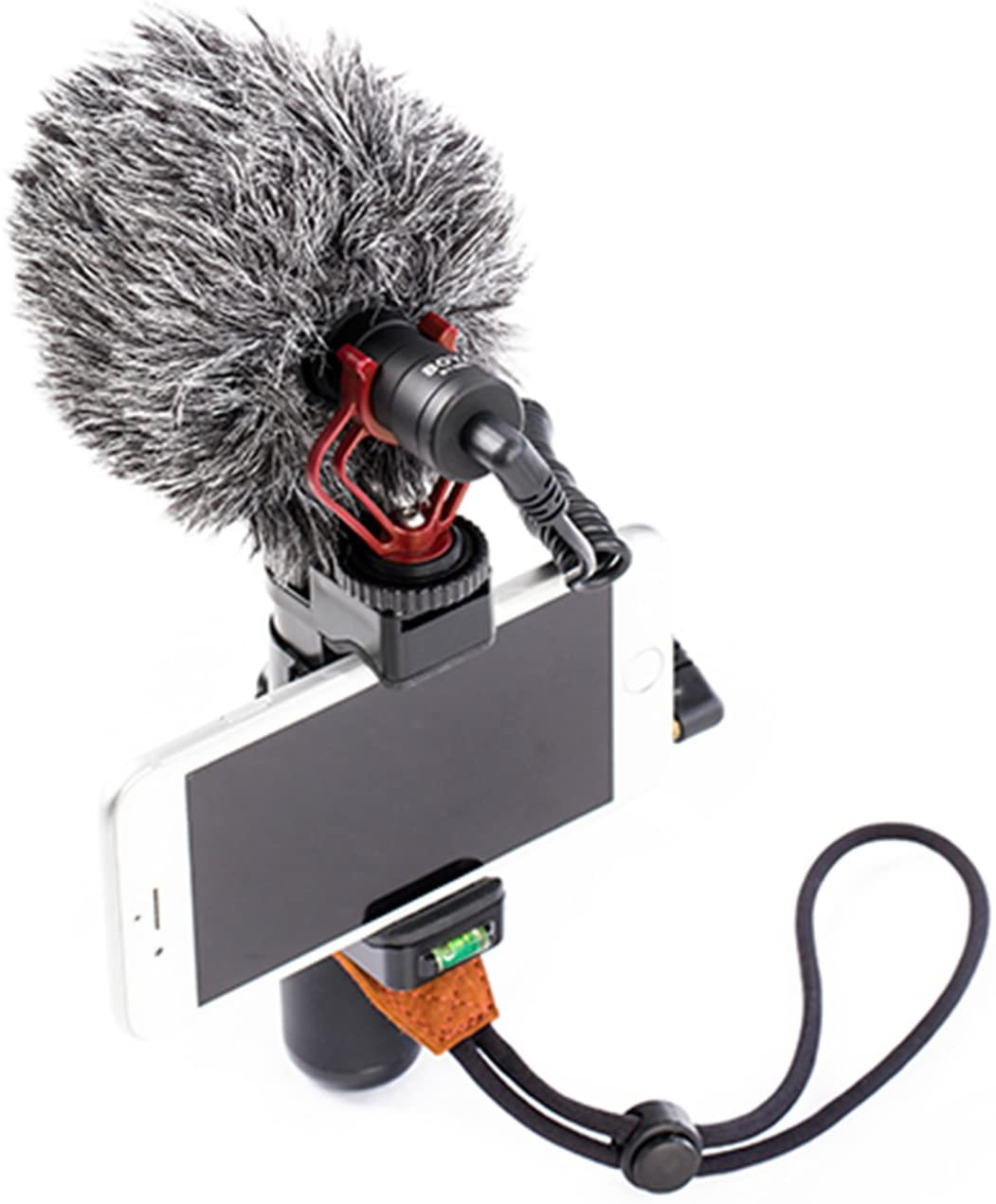 Een microfoon met een fuzzy voorruit bevestigd aan een telefoonhouder met een telefoon en een riem.