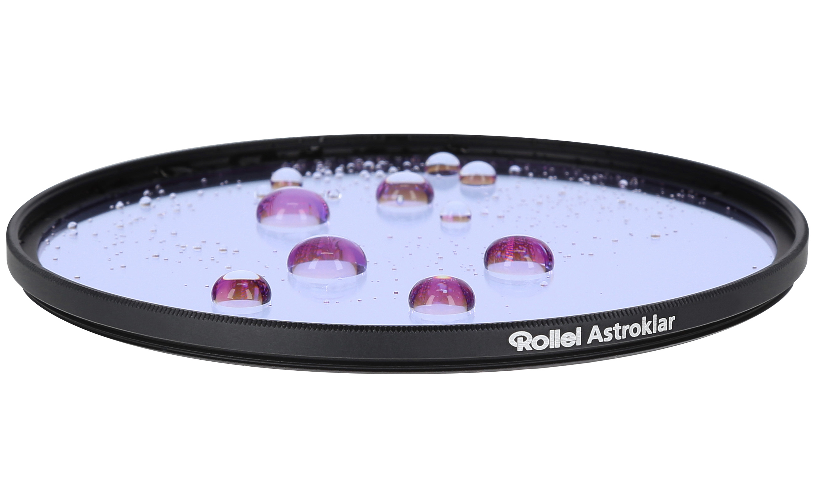A round camera filter covered in water drops.
