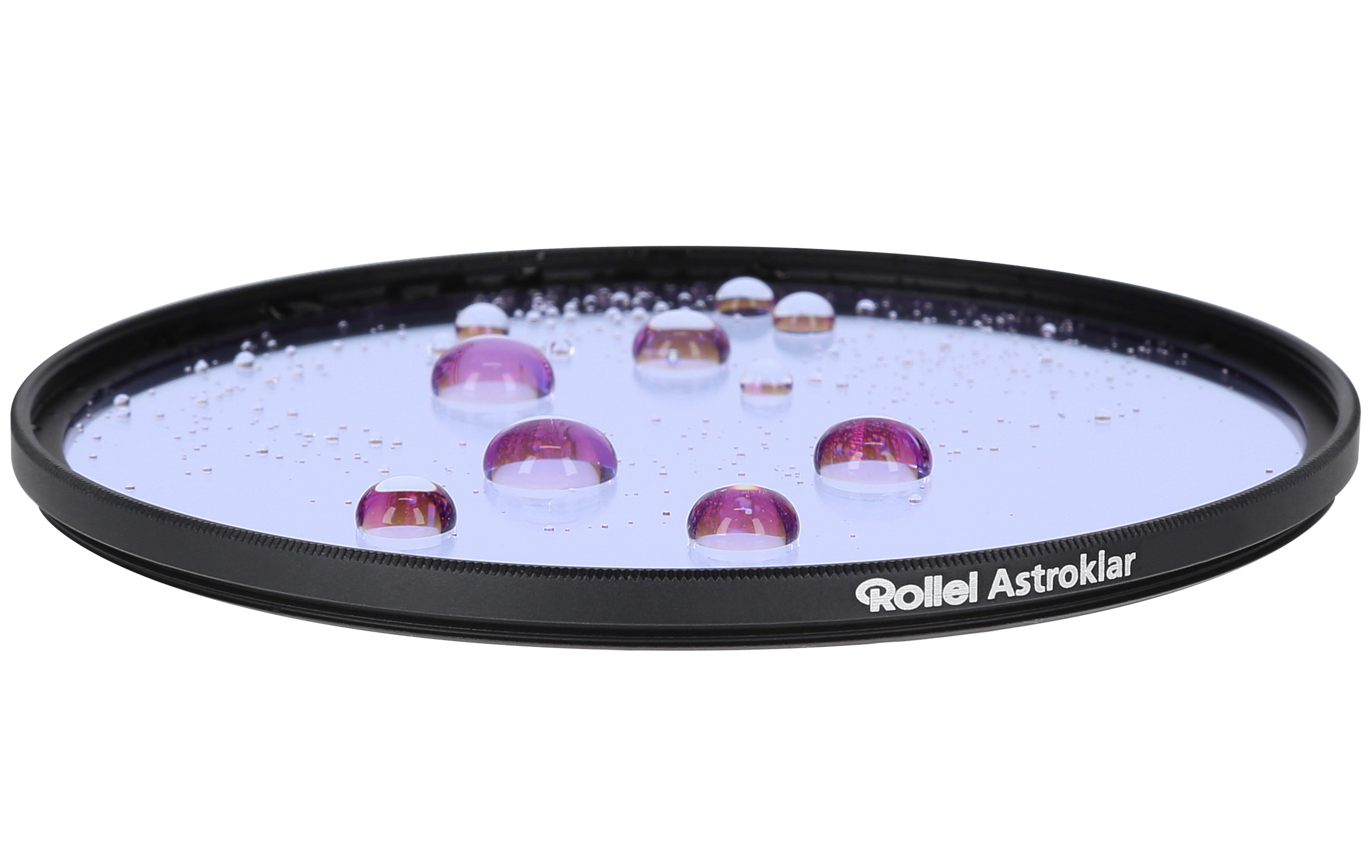 A Rollei filter with water droplets. The droplets are purple and the filter has a black rim. White background.