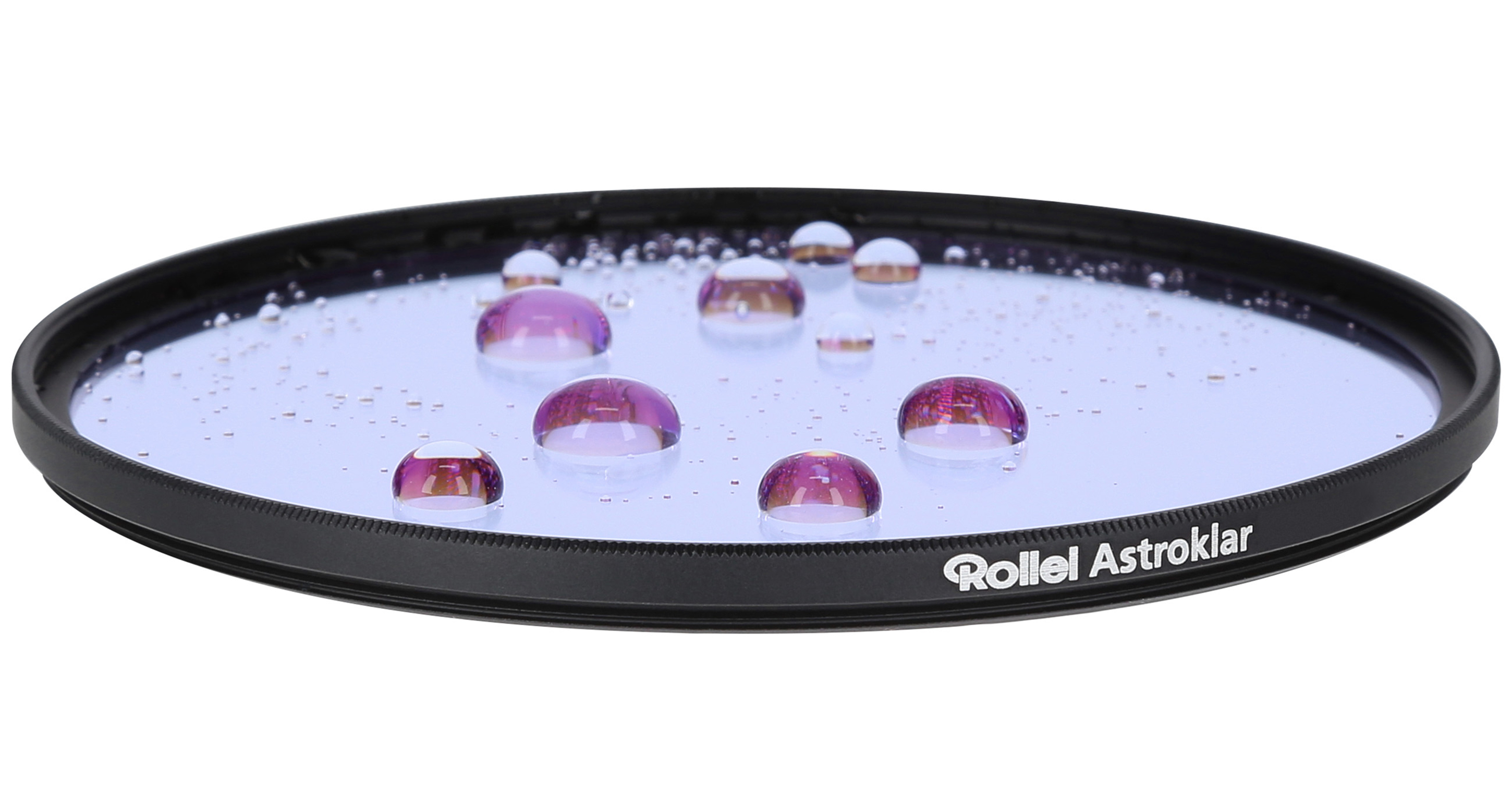 Round filter with water droplets on it. The droplets reflect light.