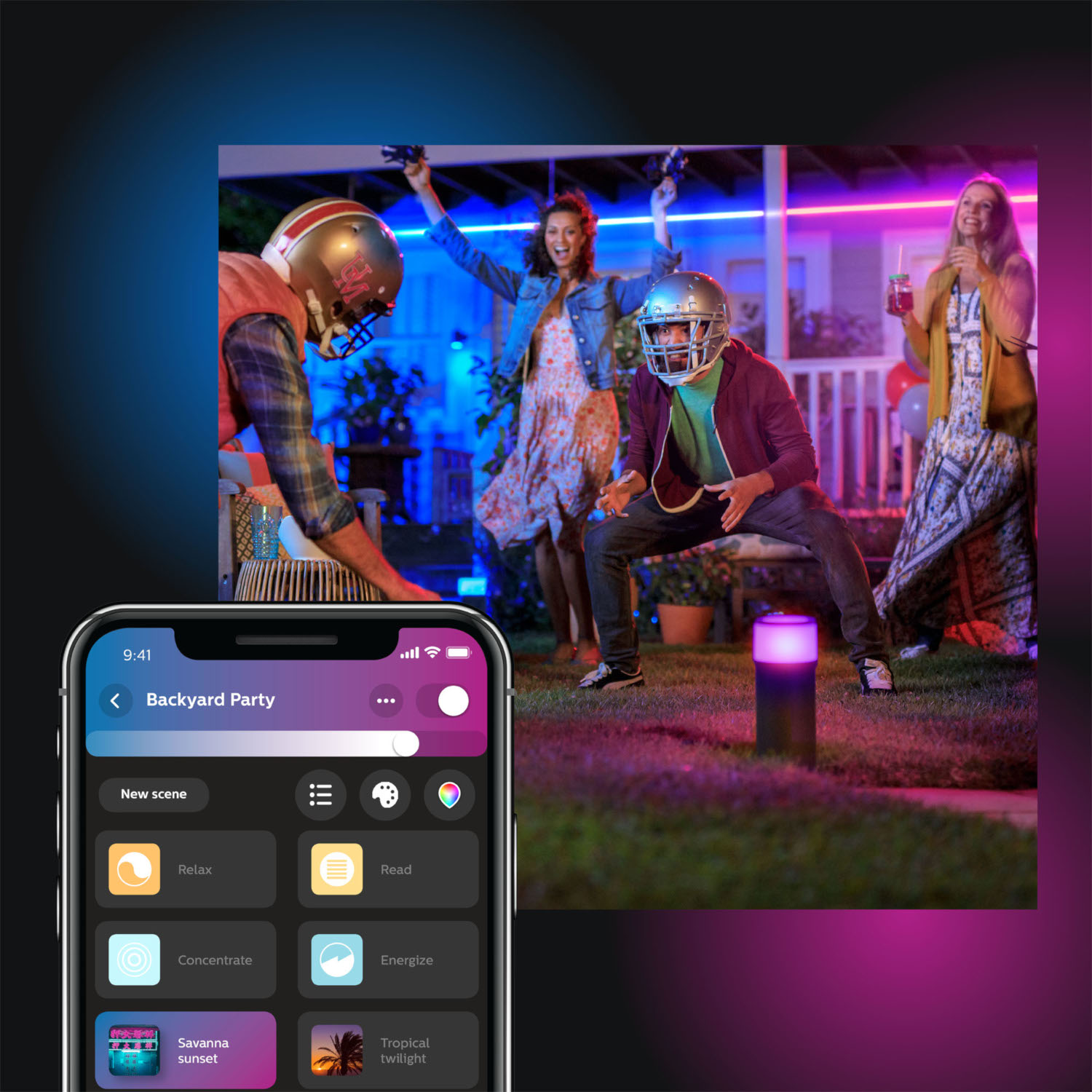People playing with lights. One in a football helmet. Phone with app showing light scene options.