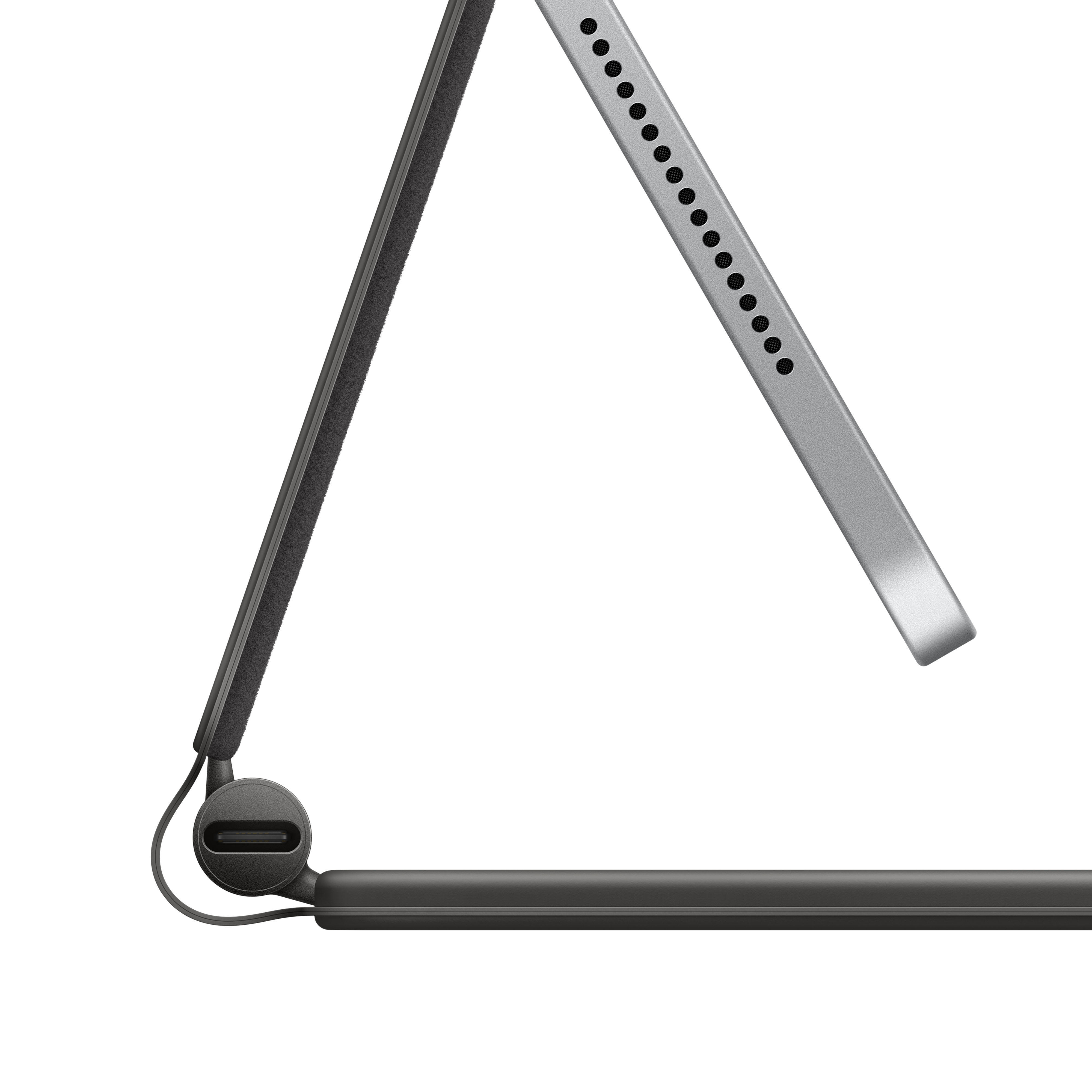 Eine Tablet-Tastatur, abgewinkelt, wobei das Gerät teilweise sichtbar ist. Schwarz und Silber.