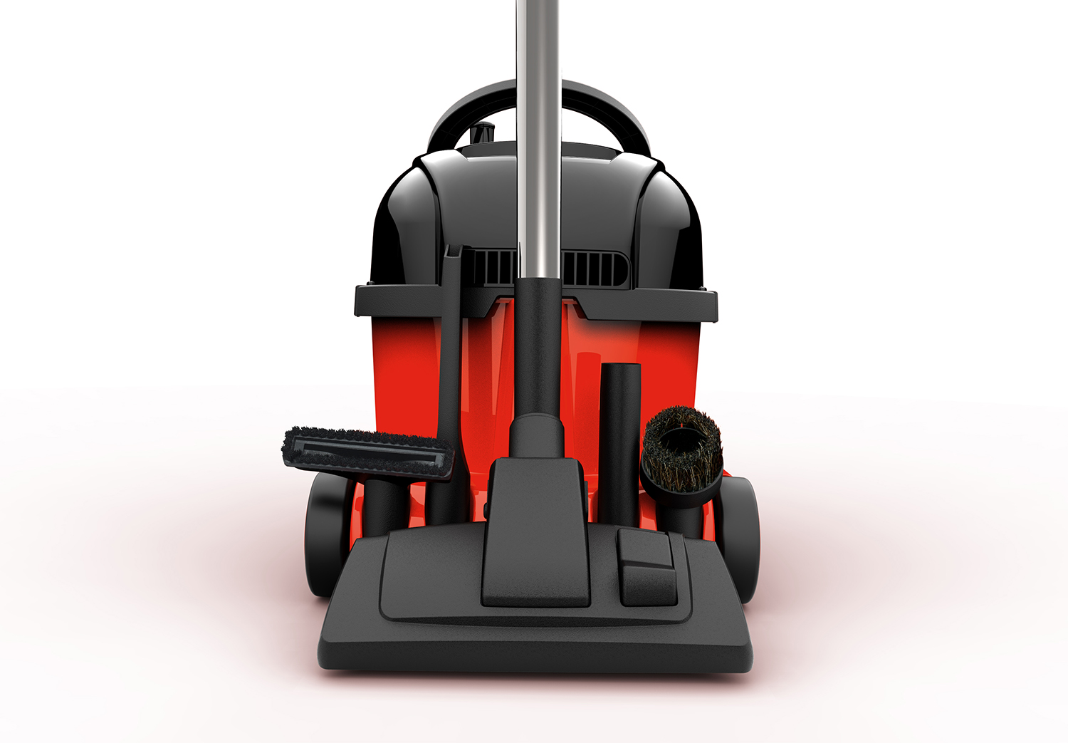 A red and black vacuum cleaner with various attachments, viewed from the front.