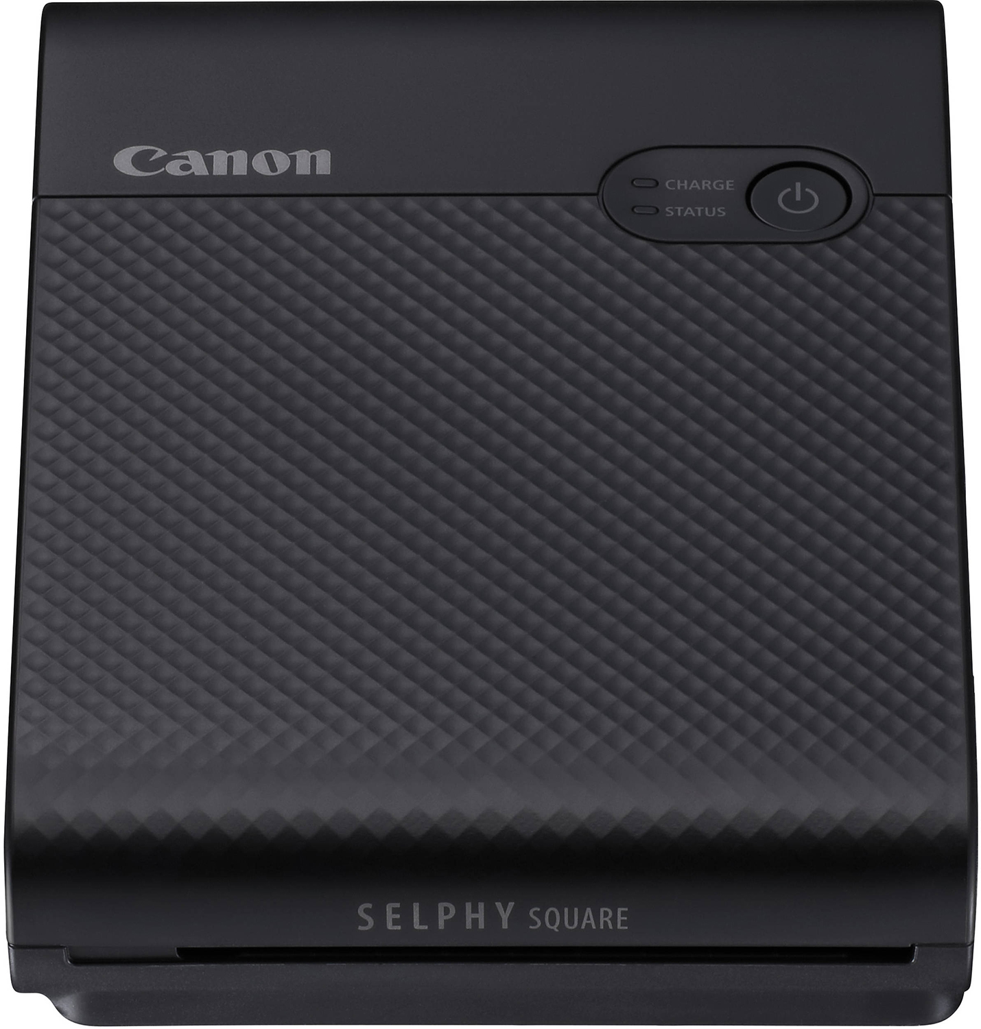 Une imprimante Canon Selphy Square noire avec une surface texturée et un bouton d'alimentation.