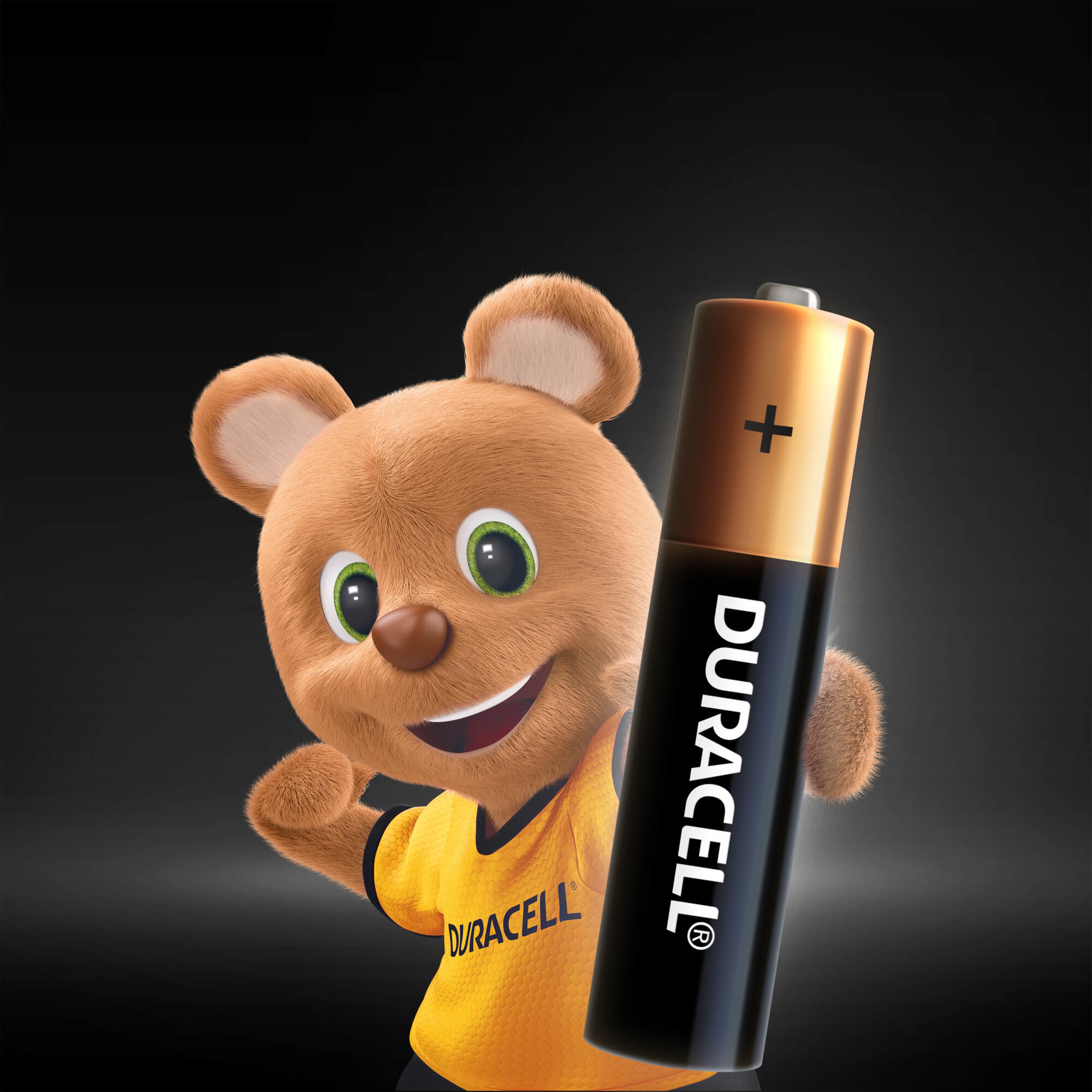 Siyah zemin üzerinde bir Duracell pil tutan, sırıtan bir Duracell oyuncak ayı.