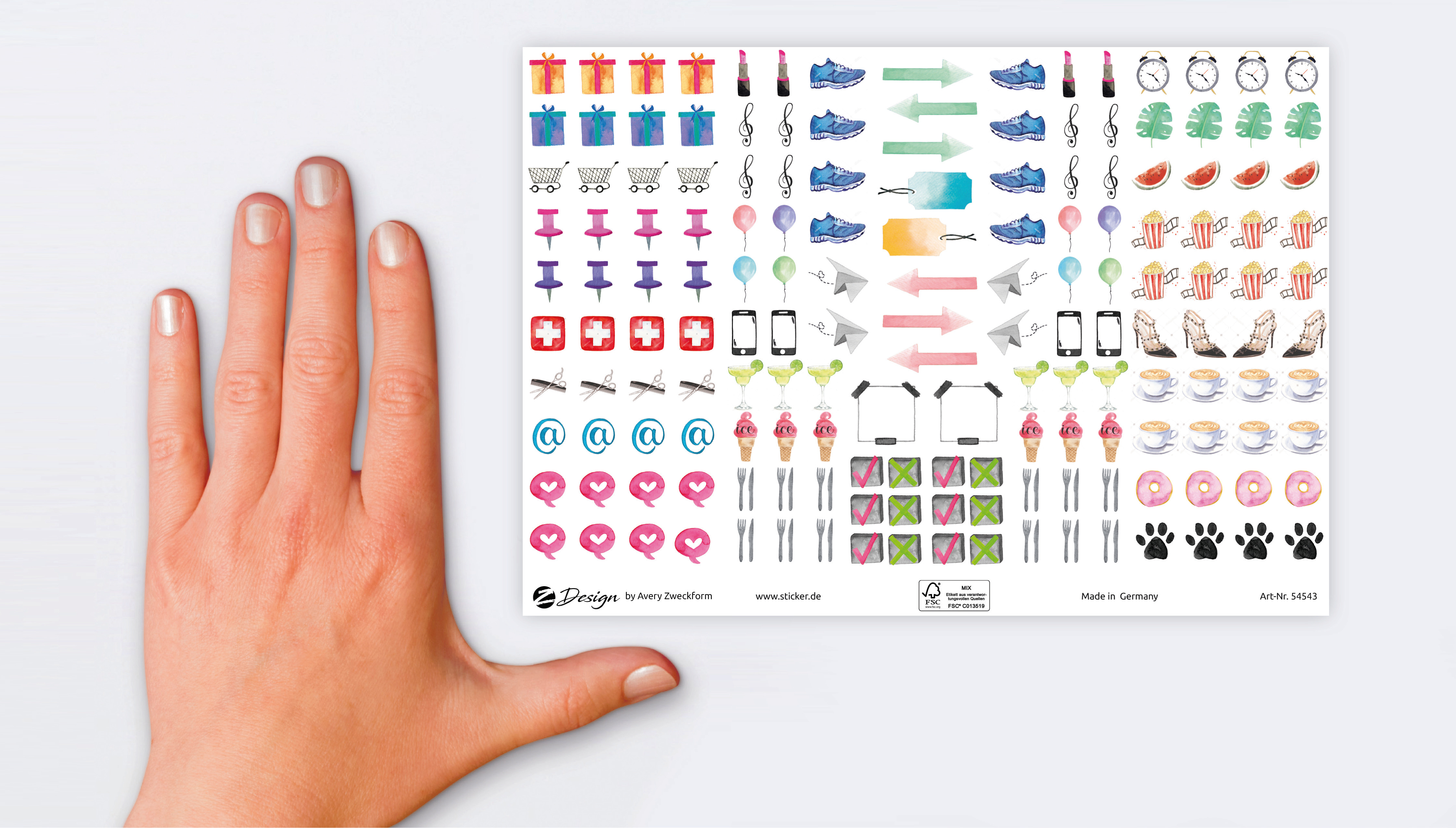 Eine Hand berührt ein Stickerbogen. Aufkleber enthalten Geschenke, Schuhe, Uhren, Herzen und Lebensmittel.