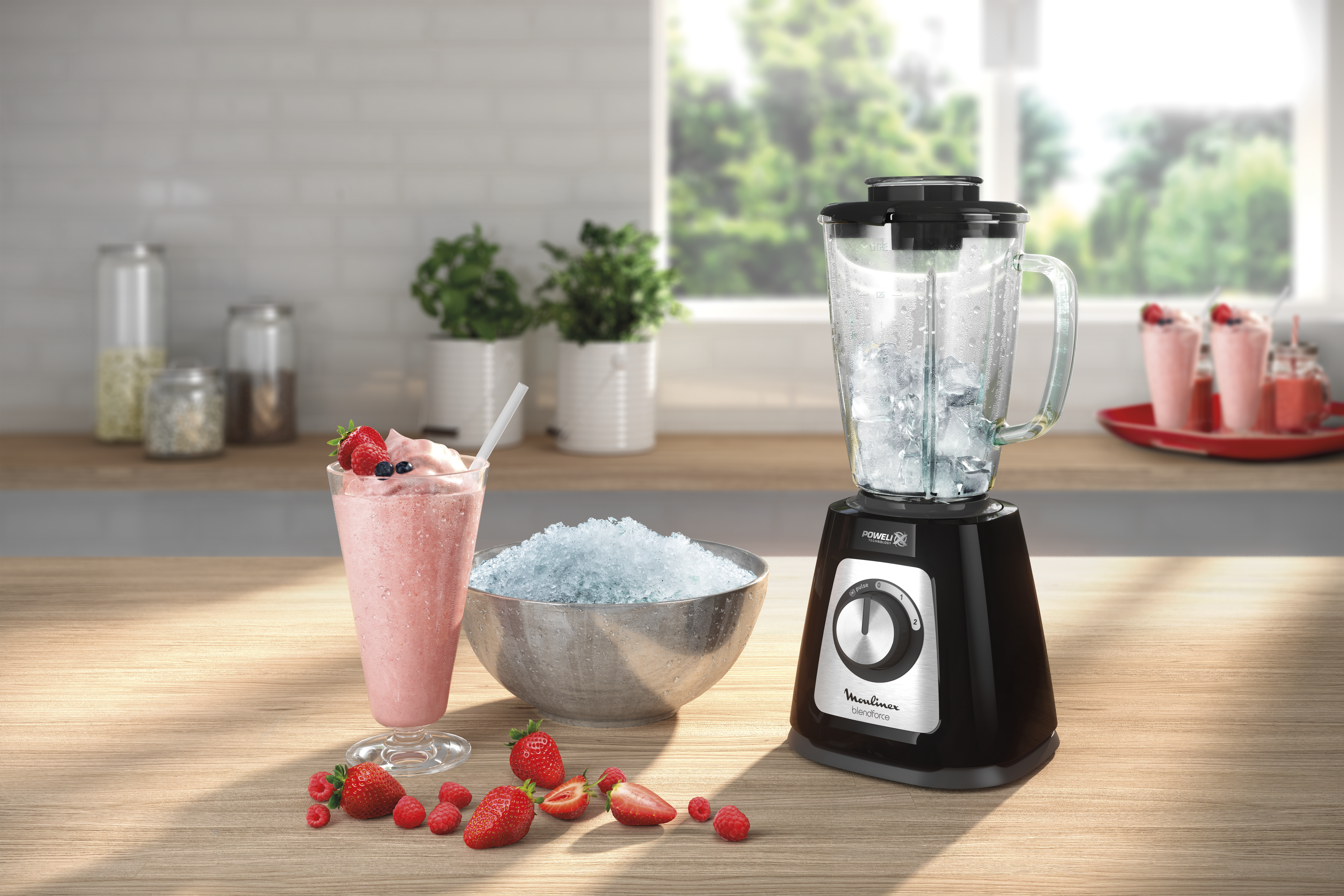 A blender, smoothie, and shaved ice sit on a wooden surface. Strawberries and raspberries are scattered around. Green plants and a window are in the background.
