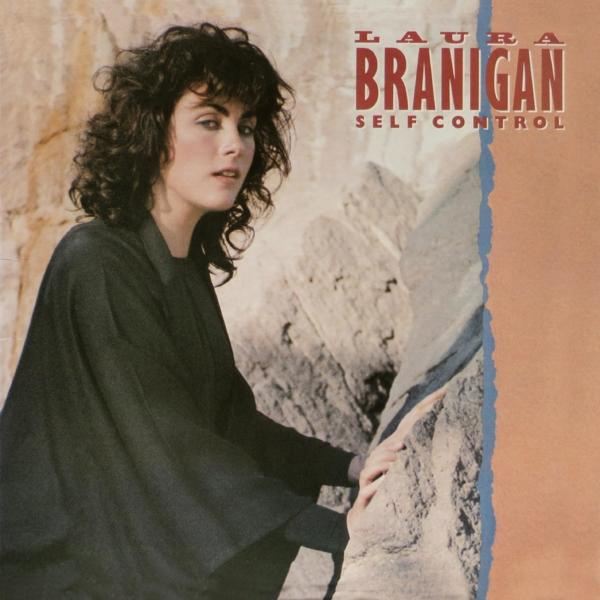 Albumcover: Frau in Schwarz auf felsiger Oberfläche, Titeltext oben.