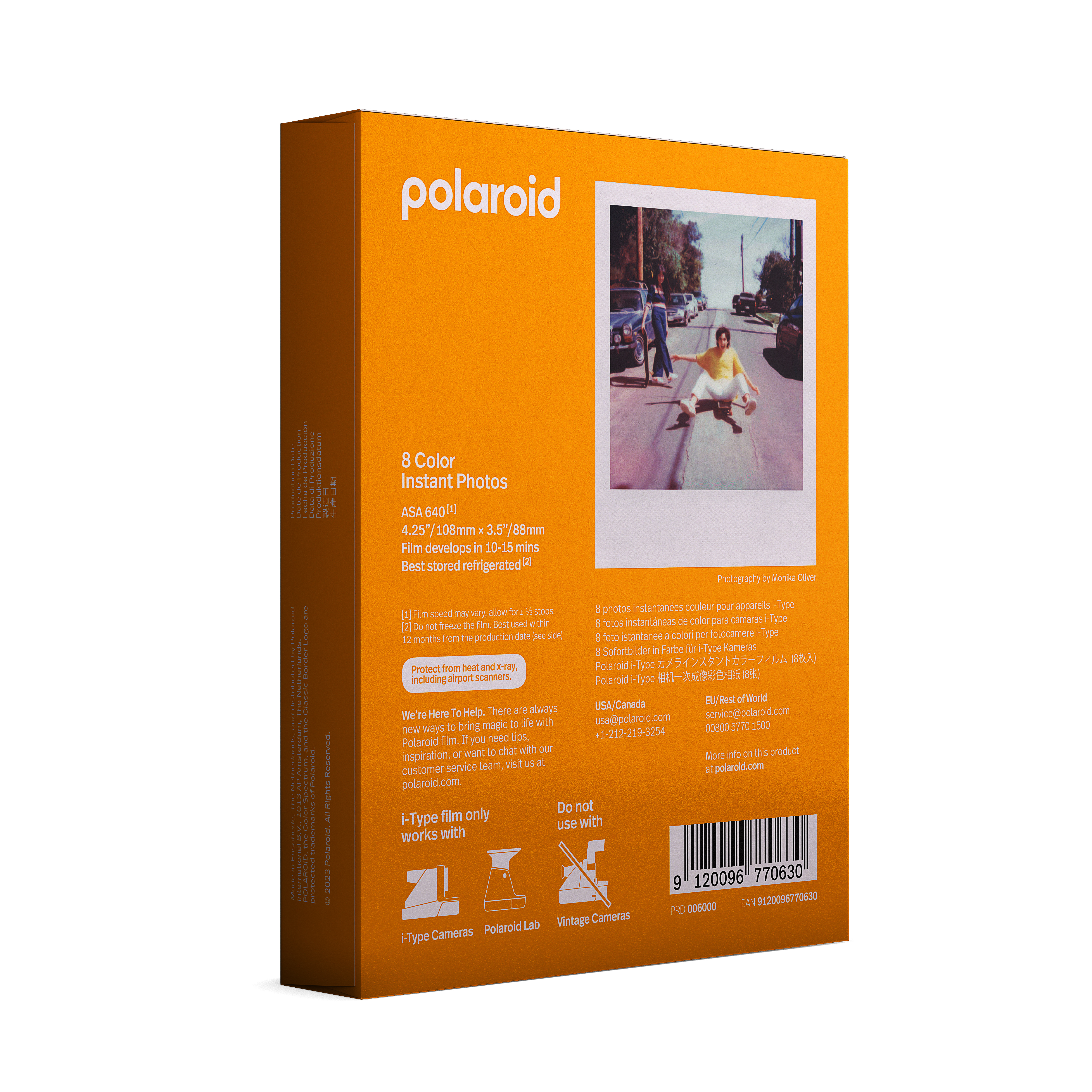 Polaroid instant film box, with a person in a yellow shirt, in the background.