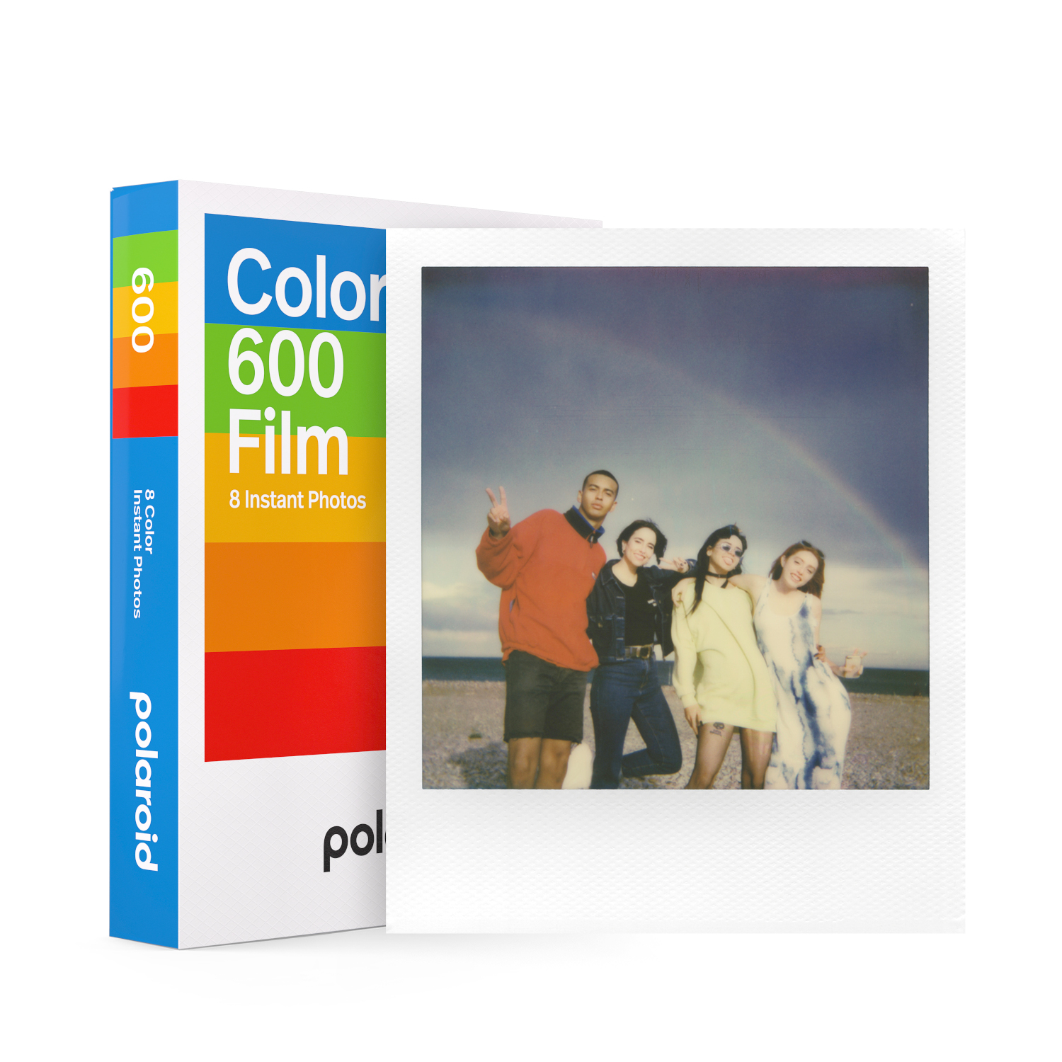 A Polaroid film box with a photo of four people on a beach with a rainbow.