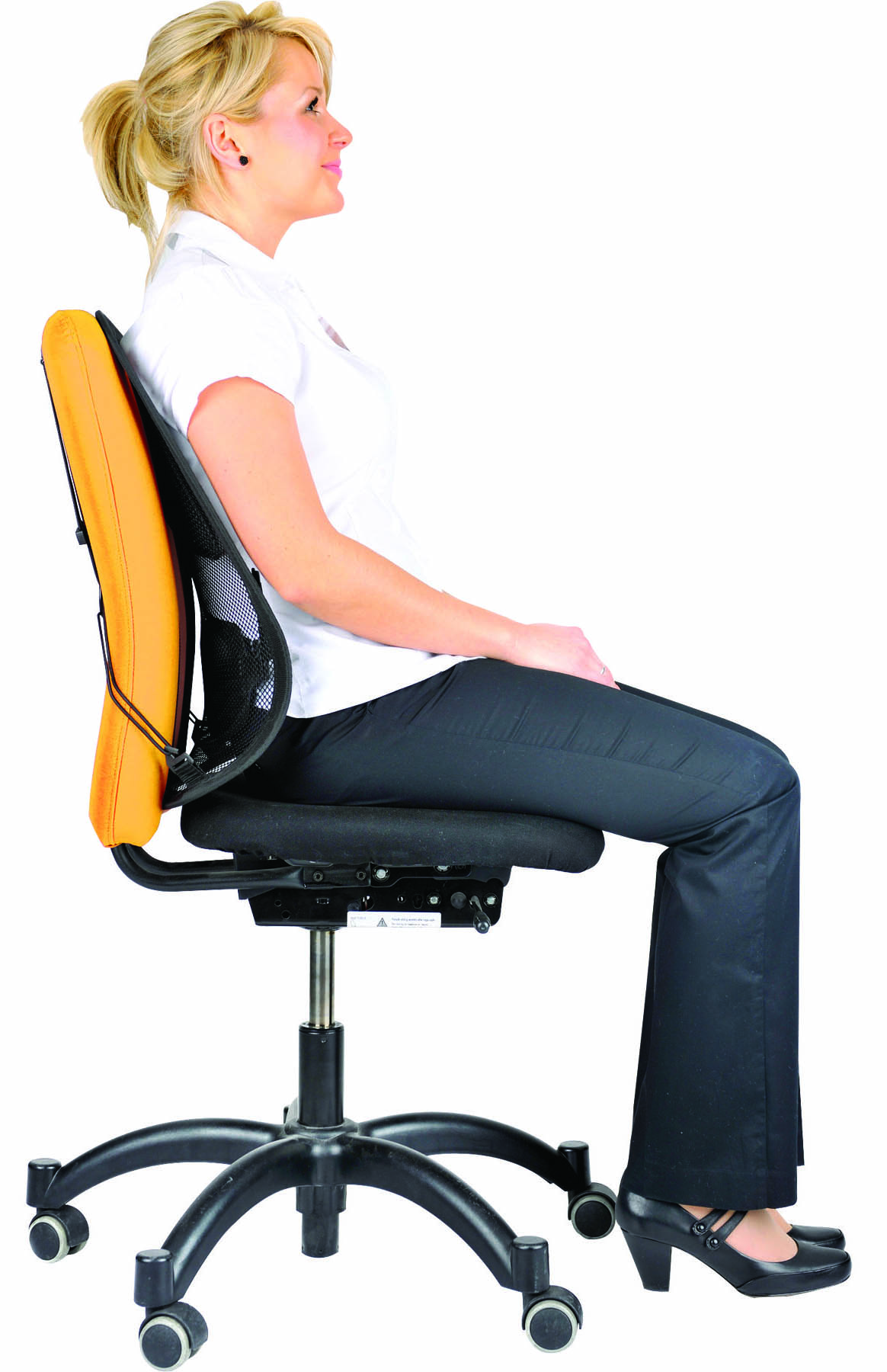 Woman sitting on an ergonomic office chair. She is wearing a white shirt and black pants.