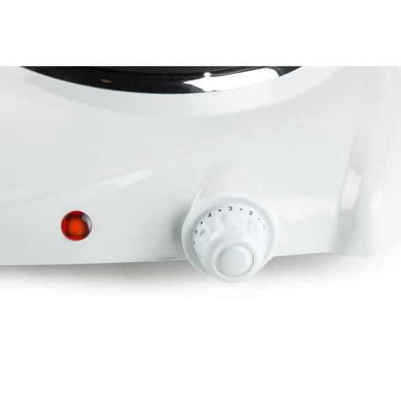 A close-up of a white electric stove's control panel, showing a red light and a numbered dial.