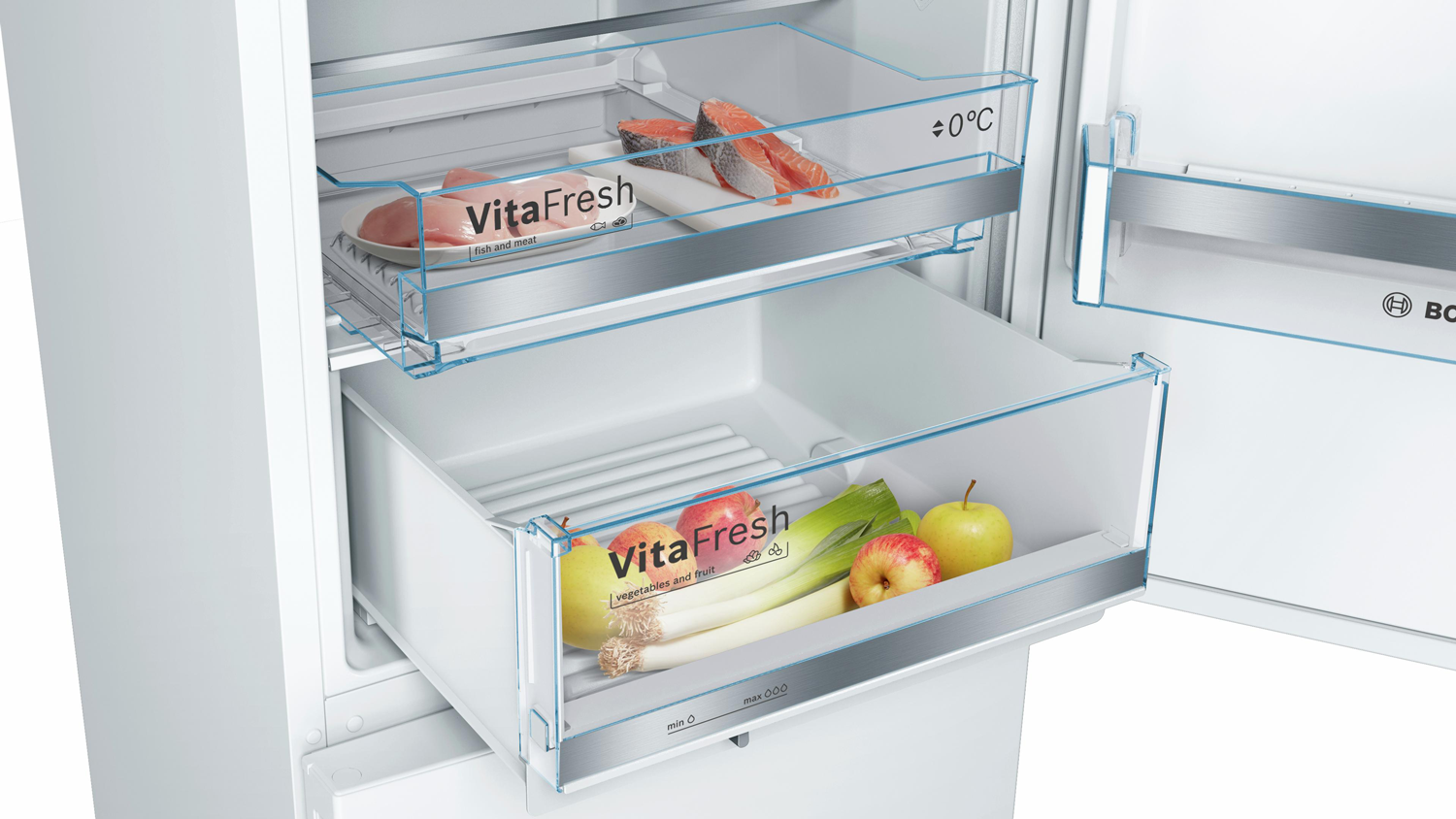Refrigerator interior with drawers. Vegetables and meat are stored. White background.