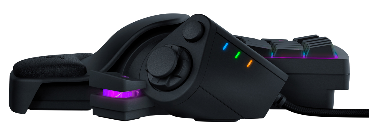 Black gaming keypad with buttons and a joystick, isolated on white background.