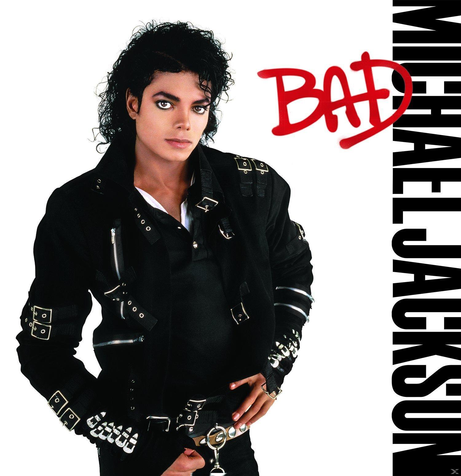 Michael Jackson 'Bad' Albumcover. Michael in schwarzer Jacke und Hose, roter 'BAD'-Text rechts.