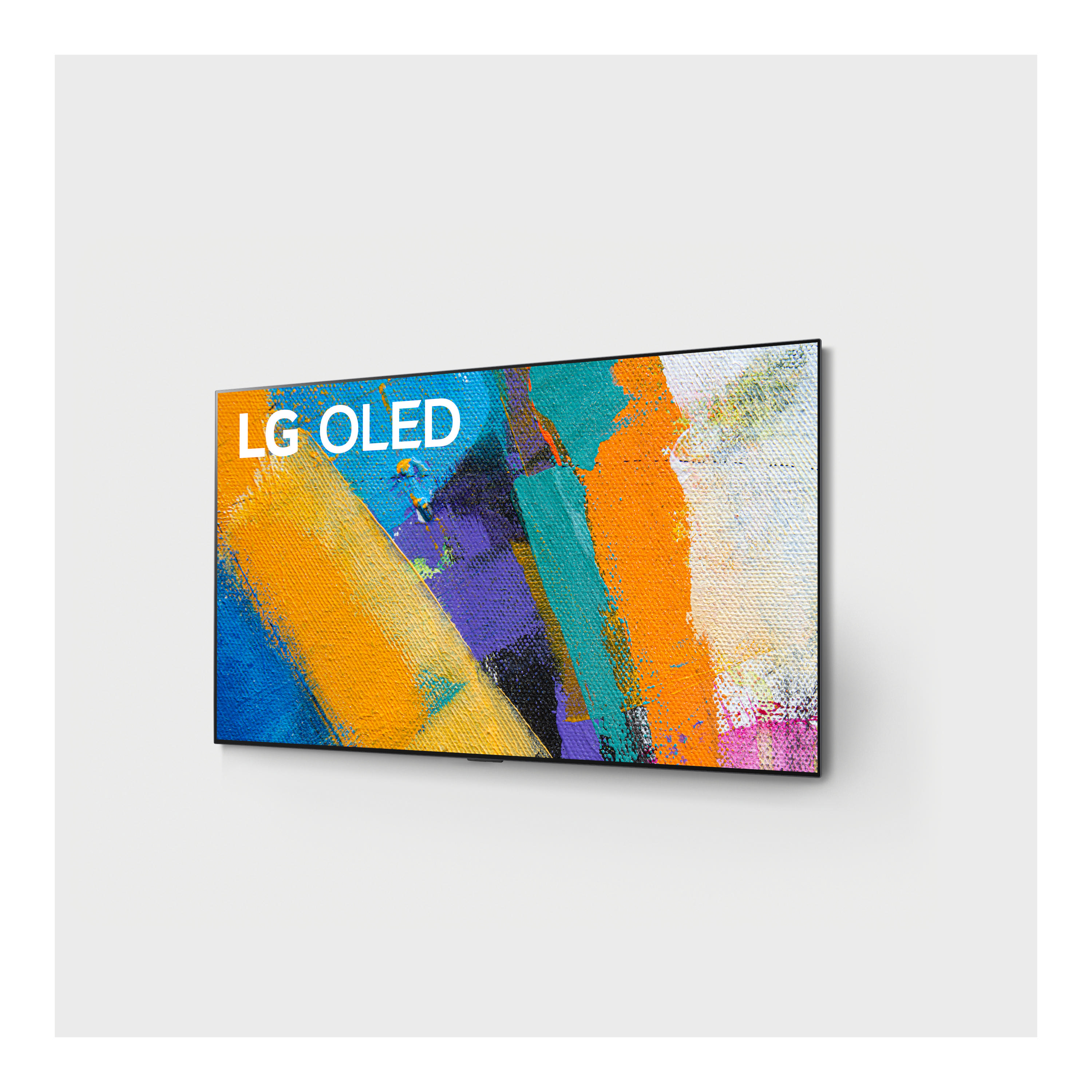 Ein LG OLED-Fernseher an einer weißen Wand mit farbenfroher abstrakter Kunst.