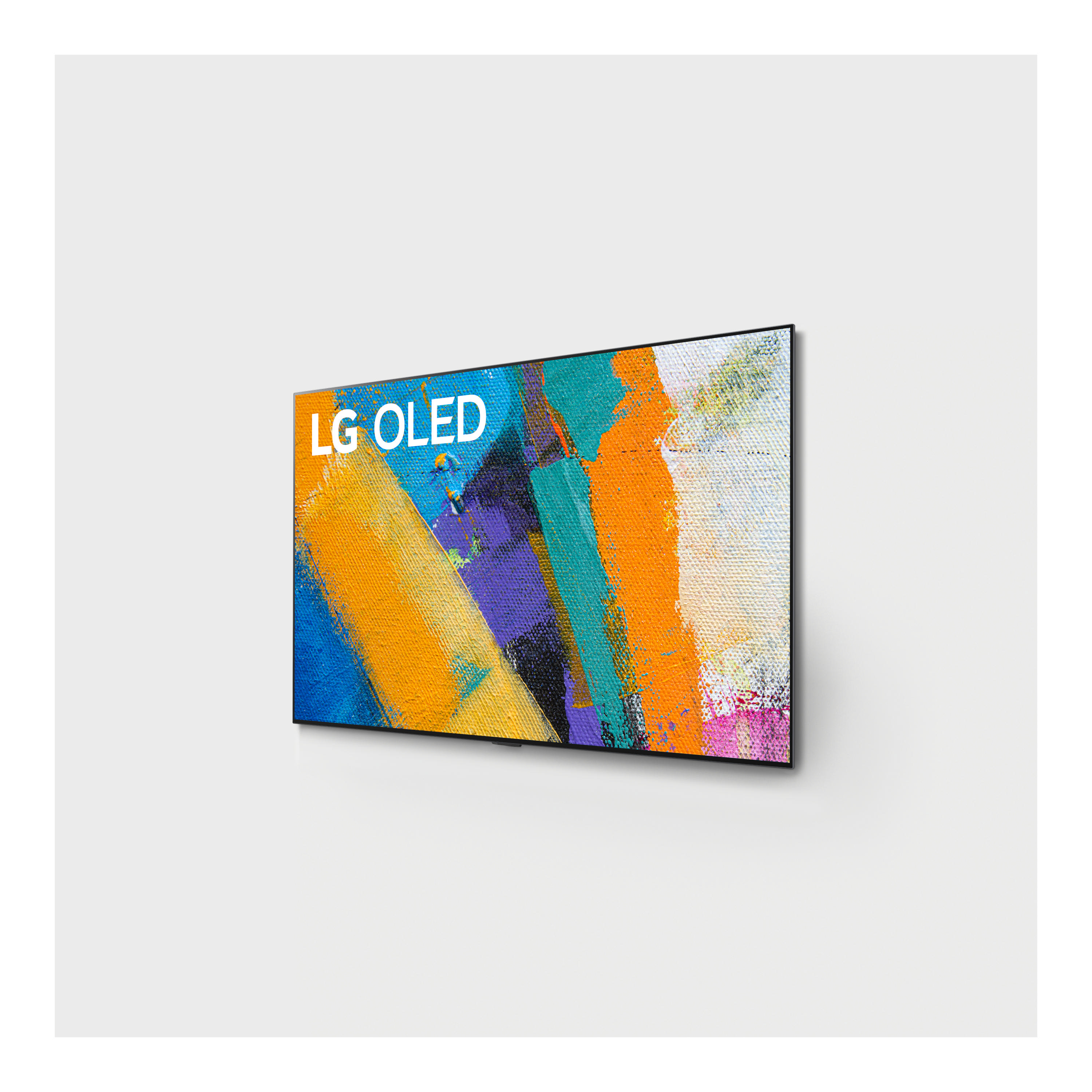 LG OLED-Fernseher an weißer Wand, der ein abstraktes Gemälde mit Orange, Blau und Lila zeigt.